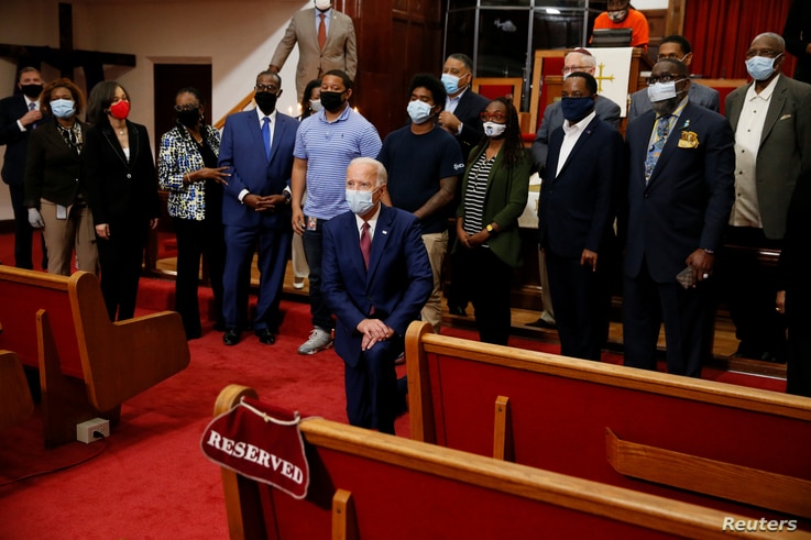 U.S. Democratic presidential candidate and former Vice President Joe Biden poses for a picture with Pastor of the Bethel AME…