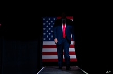 President Donald Trump arrives on stage to speak at a campaign rally at the BOK Center, Saturday, June 20, 2020, in Tulsa, Okla…