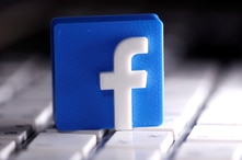 FILE PHOTO: A 3D-printed Facebook logo is seen placed on a keyboard in this illustration taken March 25, 2020. REUTERS/Dado…
